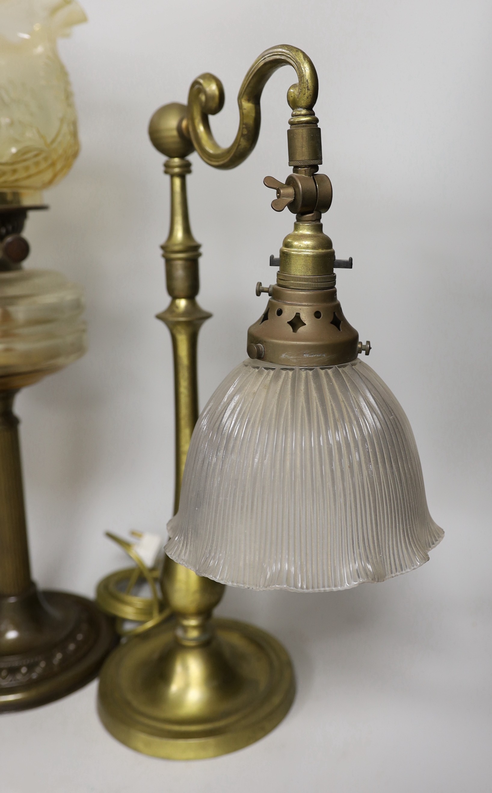 An Edwardian brass desk lamp with glass shade and a Victorian brass columned oil lamp with shade, oil lamp 65cms high